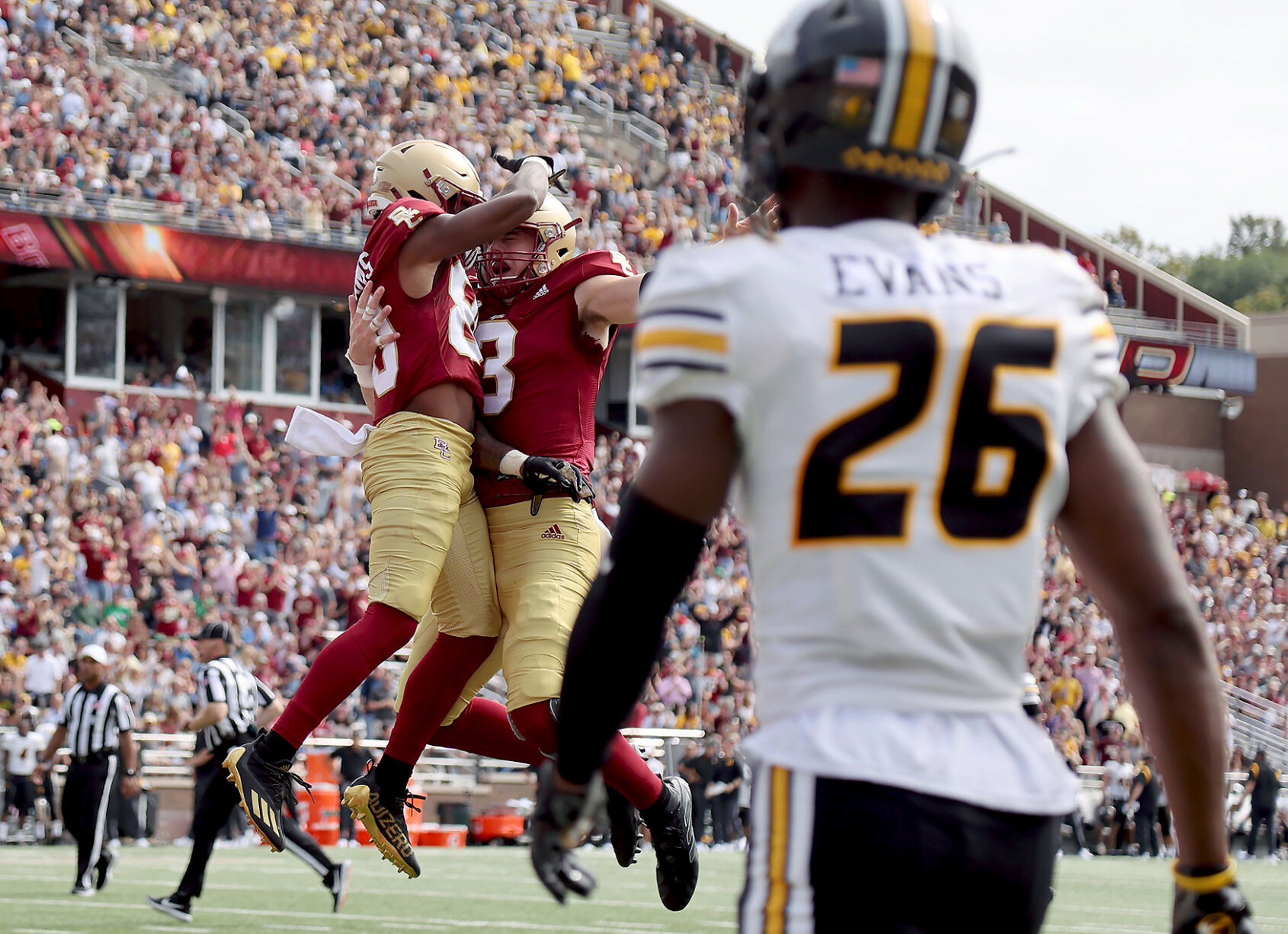 Boston College wide receiver Jaden Williams is congratulated by quarterback Dennis Grosel after scoring a touchdown as Missouri defensive back Akayleb Evans